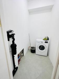 a laundry room with a washer and dryer at Sumqayit citi in Sumqayıt +40 photos