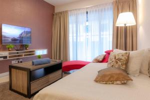 Ένα ή περισσότερα κρεβάτια σε δωμάτιο στο Relaxing High-Floor Stay at Suasana Suites JB +20 φωτογραφίες