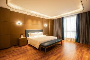 Postel nebo postele na pokoji v ubytování DongHu Resort Hotel