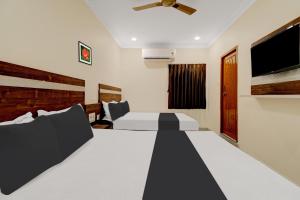 Giường trong phòng chung tại Hotel O Leela Elite +25 ảnh