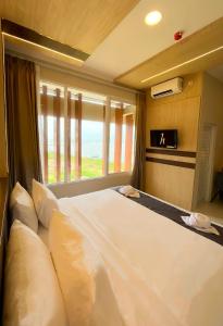 Katil atau katil-katil dalam bilik di Horison Resort Antawirya Jepara