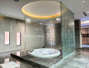 a large bathroom with a tub in a room at All-Ur Boutique Motel - Taichung Branch in Taichung +53 photos