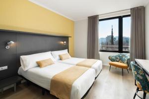 Posteľ alebo postele v izbe v ubytovaní Hotel Alimara