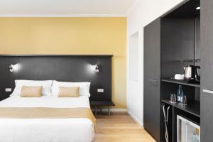Posteľ alebo postele v izbe v ubytovaní Hotel Alimara