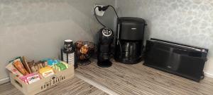 a coffee maker and a box next to a microwave at Balchik Sea View Escape 5BR Luxury with Hot Tub & Free Parking in Balchik
