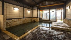 a room with a pool of water in a building at Nishiizu Koyoi in Numazu +53 photos