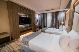 Postel nebo postele na pokoji v ubytování Mirnian Hotel