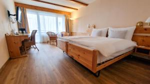 Rúm í herbergi á Sunstar Hotel Lenzerheide