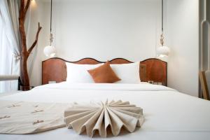 Postel nebo postele na pokoji v ubytování Me Saigon Boutique Hotel