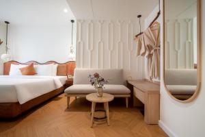 Postel nebo postele na pokoji v ubytování Me Saigon Boutique Hotel