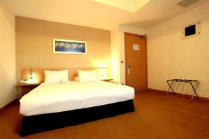 Postel nebo postele na pokoji v ubytování Orucoglu Oreko Hotel