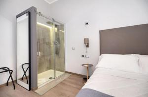 A bed or beds in a room at Clementi 18 Suites Rome