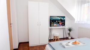 TV/Unterhaltungsangebot in der Unterkunft Jacky & Daniel's Apartments Top 2