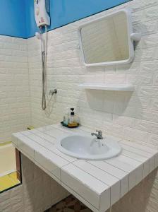 a bathroom with a white sink and a mirror at Mom Boutique Railay in Railay Beach +42 photos