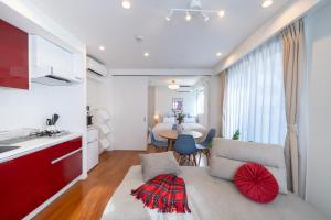 a kitchen and living room with a couch and a table at Space Roppongi in Tokyo