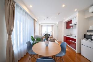 a kitchen and living room with a table and chairs at Space Roppongi in Tokyo