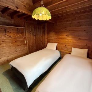 Postel nebo postele na pokoji v ubytování Guest House Vingt-Neuf 美好境界湯澤館