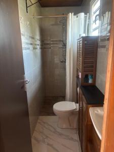 Um banheiro em Bungalow Combava