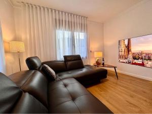 Televízia a/alebo spoločenská miestnosť v ubytovaní Holiday Home Vinya