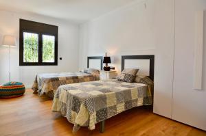 Posteľ alebo postele v izbe v ubytovaní Holiday Home Vinya