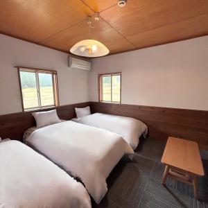 Postel nebo postele na pokoji v ubytování Guest House Vingt-Neuf 美好境界湯澤館