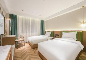 Letto o letti in una camera di Xiamen Airport SM City Plaza Yunrui Hotel