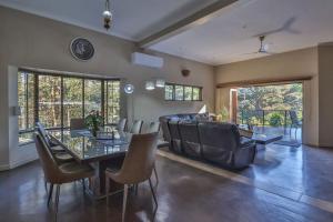 a living room with a table and a couch at Cornerstone Connection in Durban