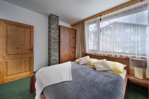 Postel nebo postele na pokoji v ubytování Happy House Apartments & Sauna