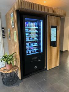 a drink vending machine in a building at City Lodge Appart Hôtel Niort in Niort