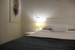 Postel nebo postele na pokoji v ubytování Suite Turati