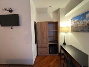 Televiisor ja/või meelelahutuskeskus majutusasutuses Vatican QG Rooms