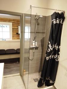 a shower with a black shower curtain in a bathroom at Beautiful Home In Aars W- in Års +25 photos
