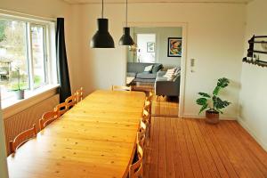 a large wooden table in a living room at Amazing Home In Rudkøbing With 6 Bedrooms And Wifi in Spodsbjerg
