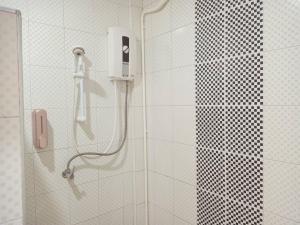 a shower with a phone in a bathroom at เกาะช้างรักดี รีสอร์ท in Ko Chang +63 photos