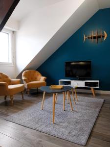 TV a/nebo společenská místnost v ubytování Charmant appartement bord de mer