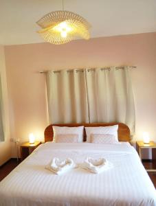 Voodi või voodid majutusasutuse Cozy Cottage Farm stay Suanphueng toas +39 fotot