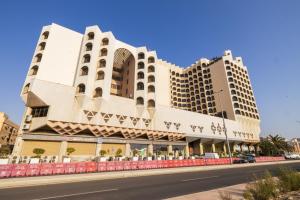 a building on the side of a street at Jeddah Grand Hotel in Jeddah