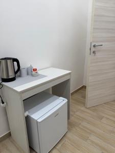 a desk with a coffee pot on it next to a door at Maison Toledo 376 in Naples