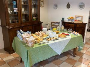 a table with a buffet of food on it at Al Vajo in Lazise