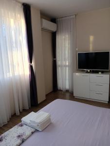 Postel nebo postele na pokoji v ubytování Apartment Andri + 11 fotografií