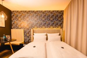 Rioca Frankfurt Posto 7客房内的一张或多张床位