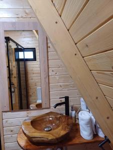 a bathroom with a wooden sink in a cabin at CABANA 365 in Braşov +157 photos