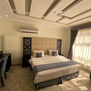 Giường trong phòng chung tại City Center Plaza Aparthotel