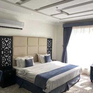 Giường trong phòng chung tại City Center Plaza Aparthotel