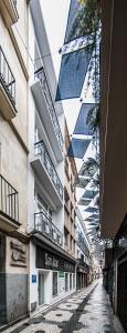 an empty street in a city with a building at Apartamentos Luxury en San Juan in Badajoz