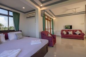 Postel nebo postele na pokoji v ubytování Broad Bean Royal Resort Goa