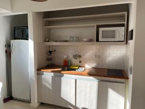 Η κουζίνα ή μικρή κουζίνα στο Calido hogar