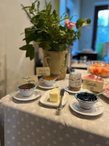 a table with bowls of food on top of it at Agriturismo Villa Di Campolungo in Fiesole +32 photos