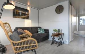 a living room with a couch and a table at House Boat Vrijthof in Maastricht