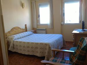 Postel nebo postele na pokoji v ubytování Hostal Sunami
